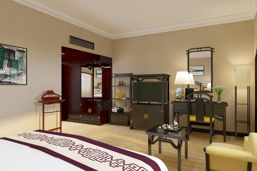 Postel nebo postele na pokoji v ubytování Yindo Jasper Hotel Zhuhai