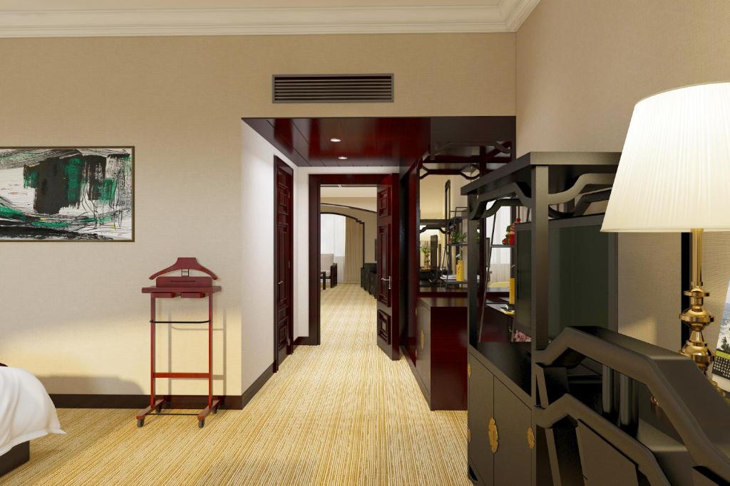 TV a/nebo společenská místnost v ubytování Yindo Jasper Hotel Zhuhai