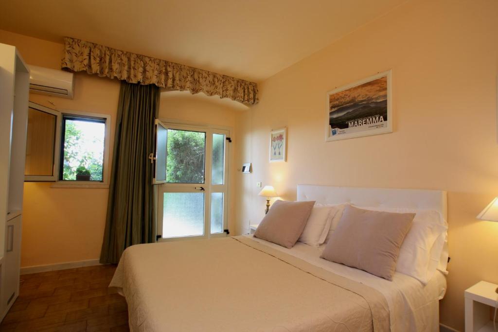 Postel nebo postele na pokoji v ubytování Agriturismo Peretti