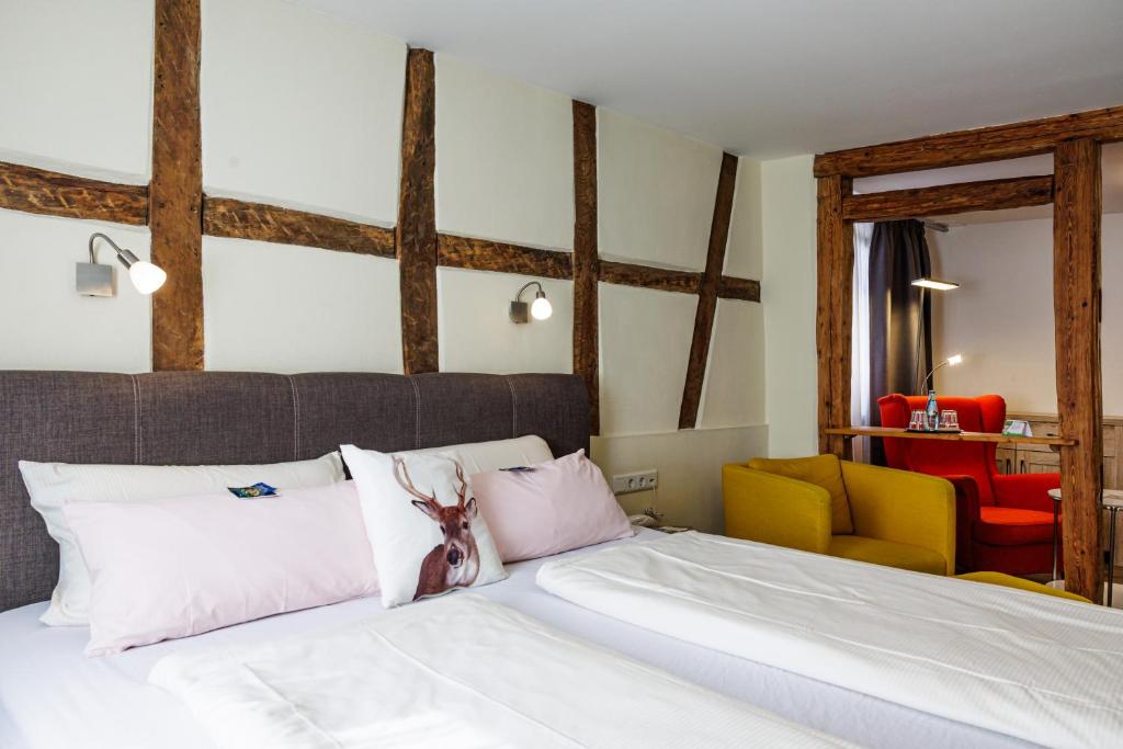 Postel nebo postele na pokoji v ubytování Flair Hotel Hopfengarten