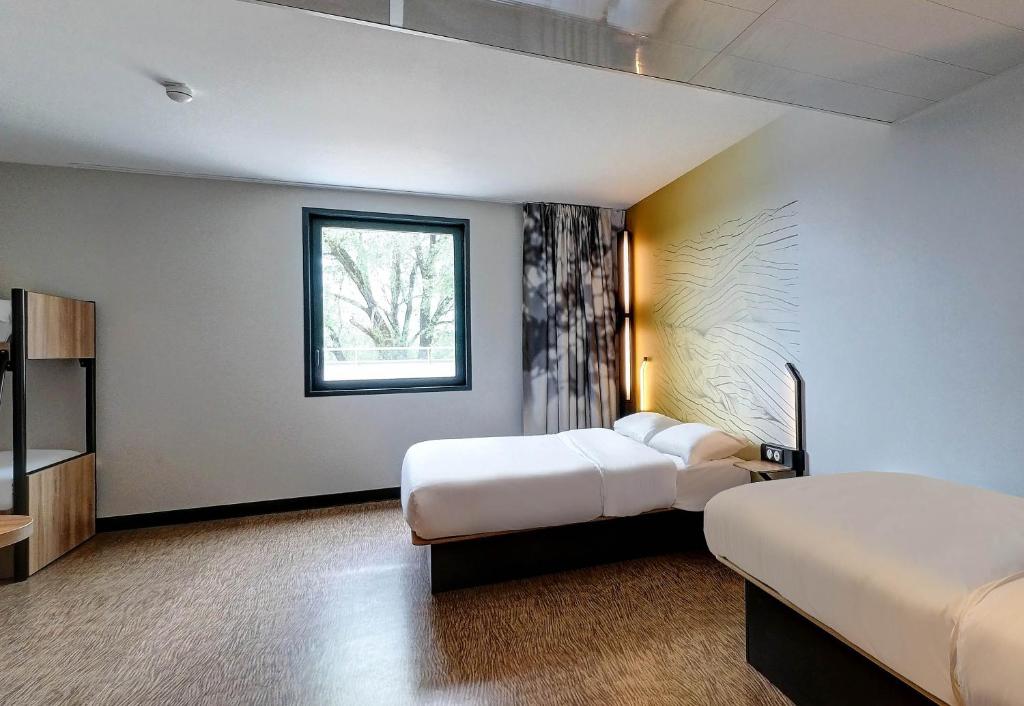 Postel nebo postele na pokoji v ubytování B&B HOTEL Besançon Valentin