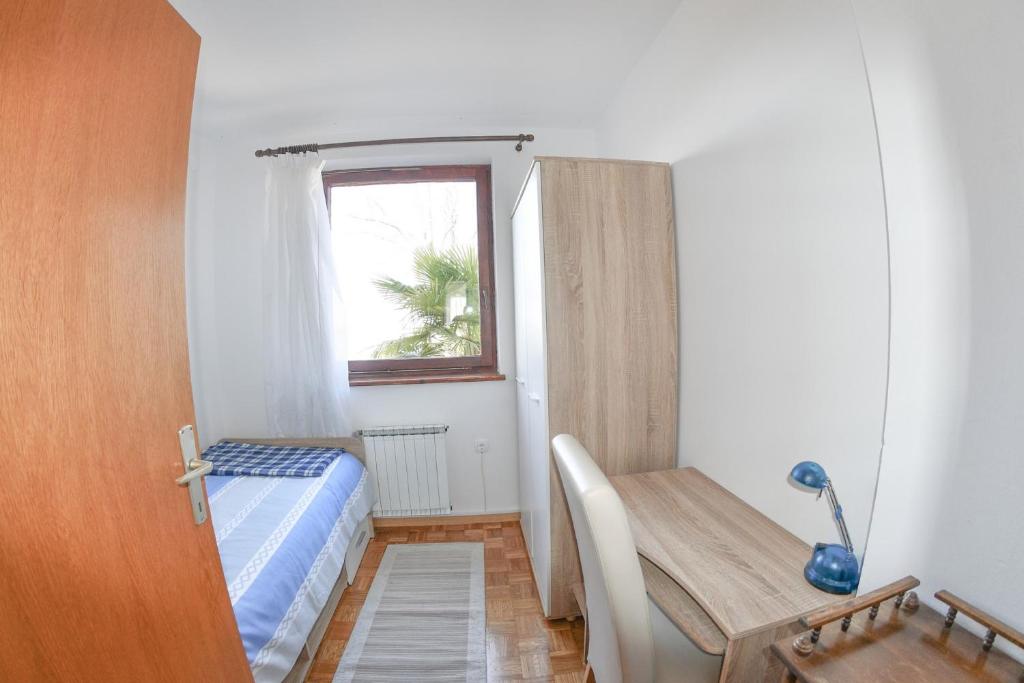 Postel nebo postele na pokoji v ubytování Apartma Breza