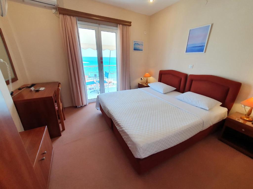 Ένα ή περισσότερα κρεβάτια σε δωμάτιο στο Acqua Marina - Άκουα Μαρίνα