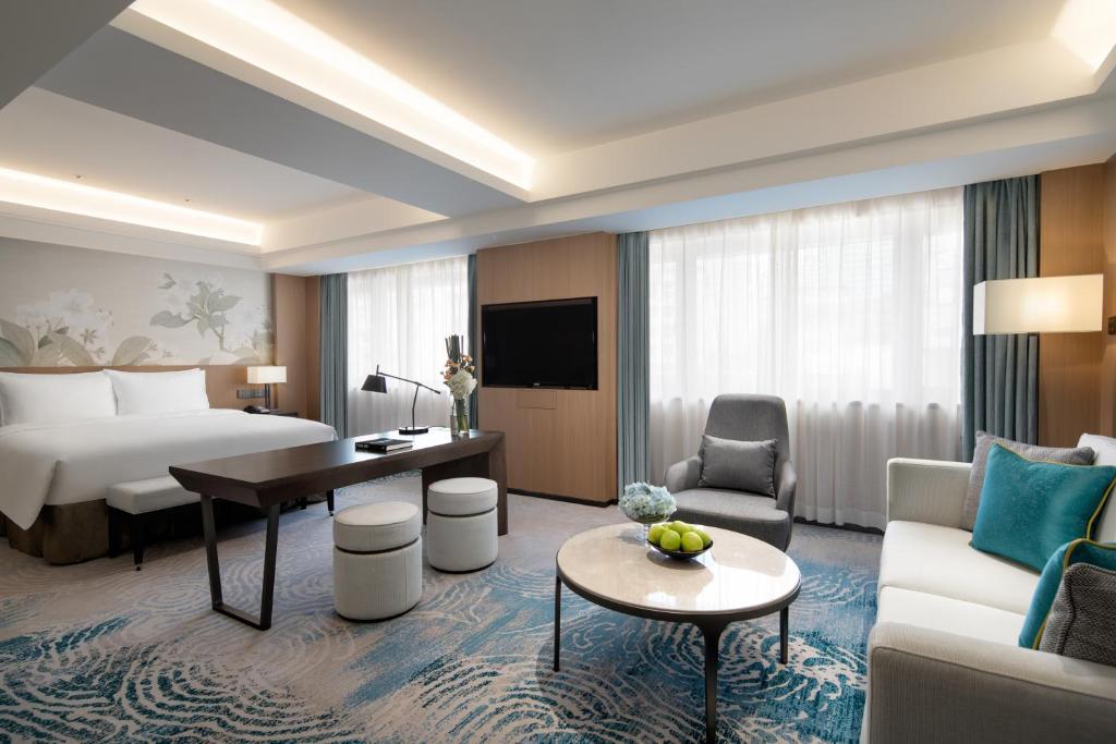 Postel nebo postele na pokoji v ubytování Foreign Trade Centre C&D Hotel,Fuzhou