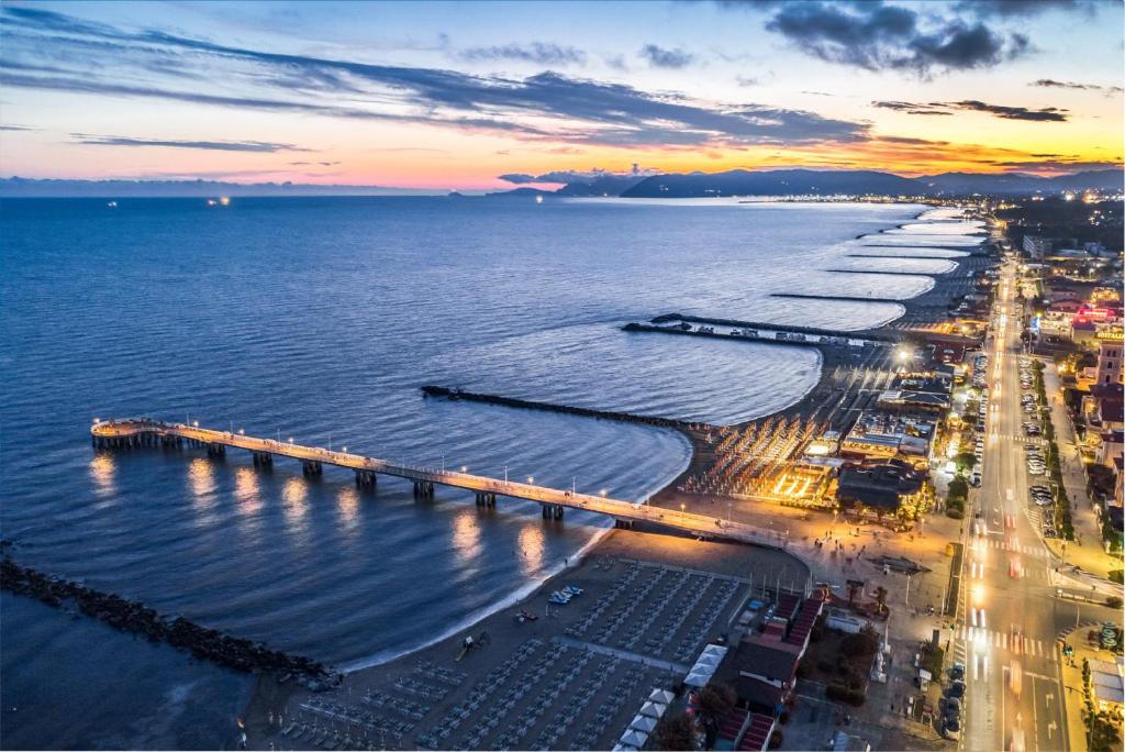 an aerial view of a beach at sunset at Hotel Excelsior in Marina di Massa