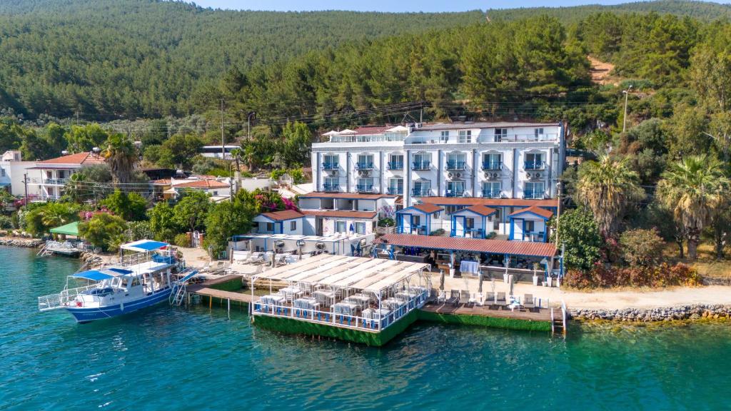 an aerial view of a resort on the water at Akyalı Boutique Hotel in Guvercinlik