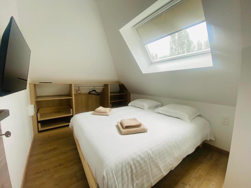 Postel nebo postele na pokoji v ubytování Gite L'Echo des 2 Baies