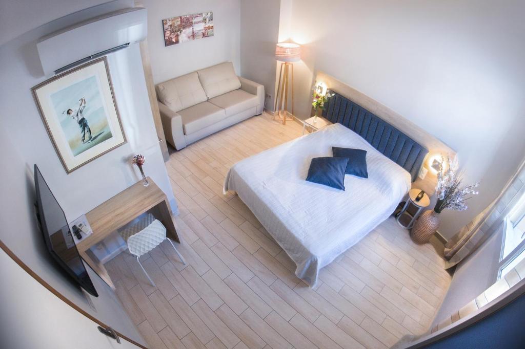 Postel nebo postele na pokoji v ubytování Hotel Le Golfe
