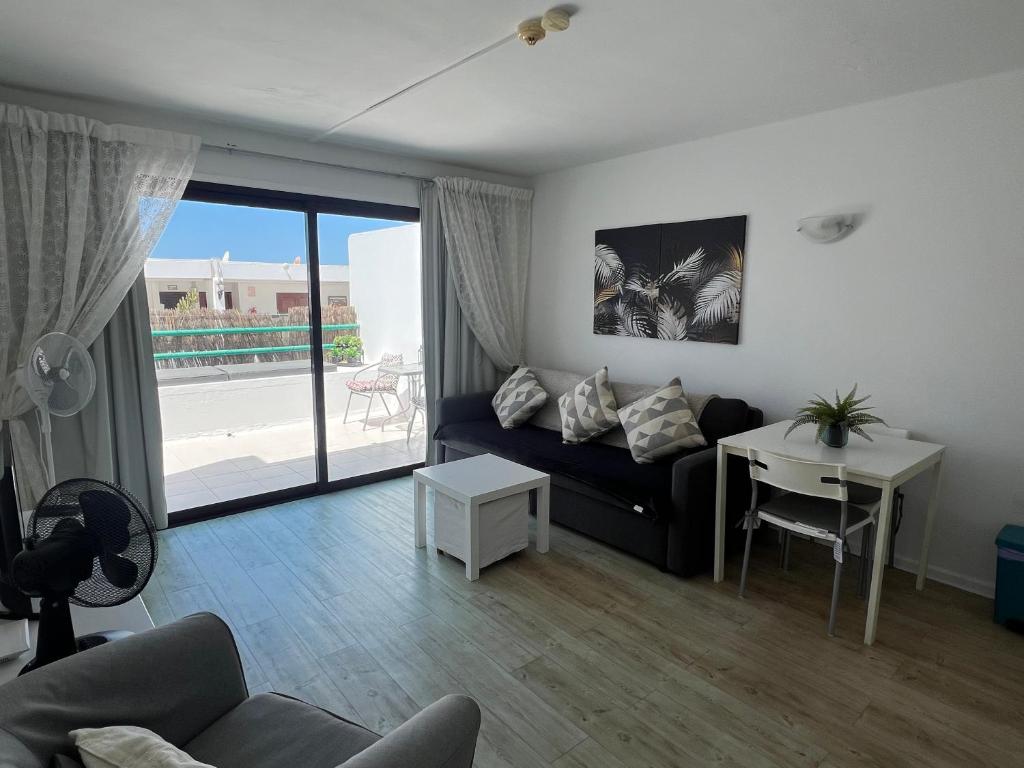 Posedenie v ubytovaní Casa Perdy, beautiful 1 bedroom apartment with communal pool