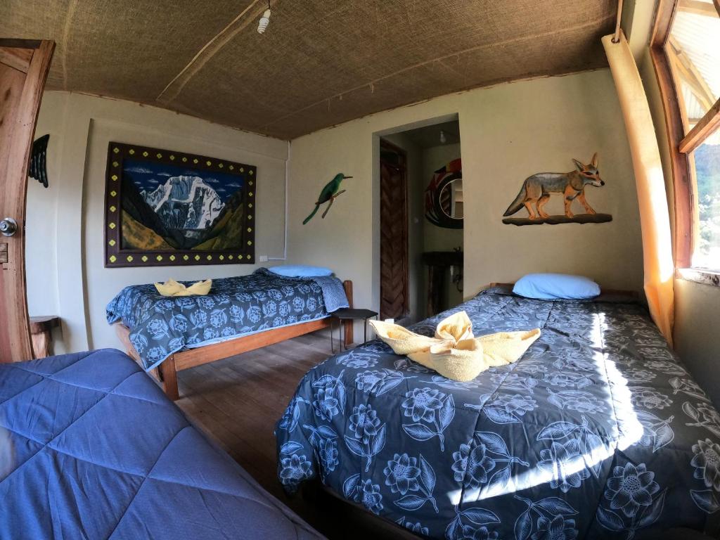Voodi või voodid majutusasutuse Salkantay Hostel Chaullay toas