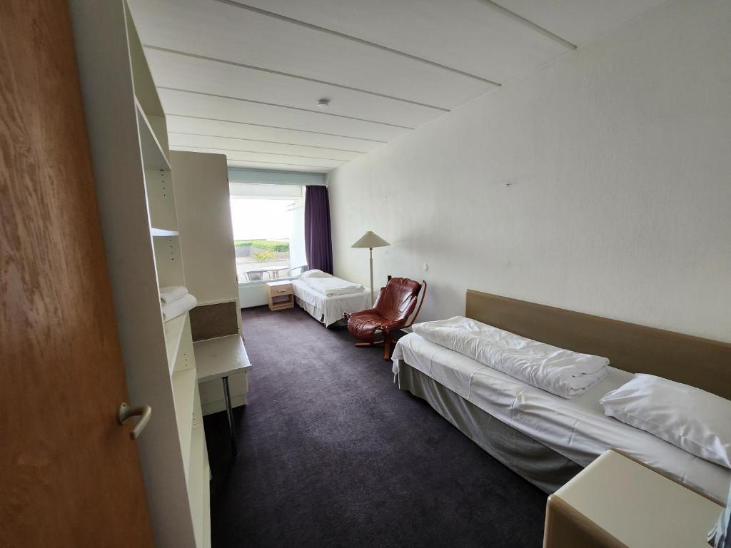 Postel nebo postele na pokoji v ubytování Hotel Østersø