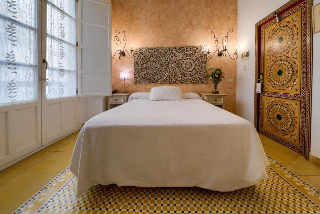 Postel nebo postele na pokoji v ubytování Hotel Argantonio