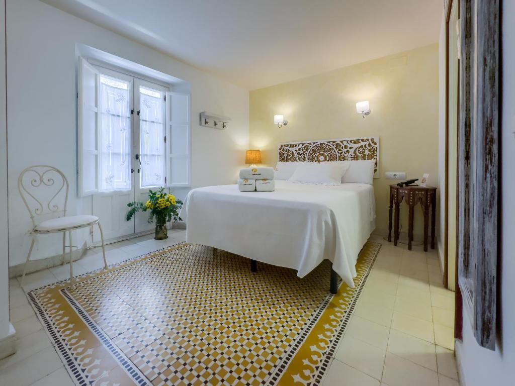 Postel nebo postele na pokoji v ubytování Hotel Argantonio