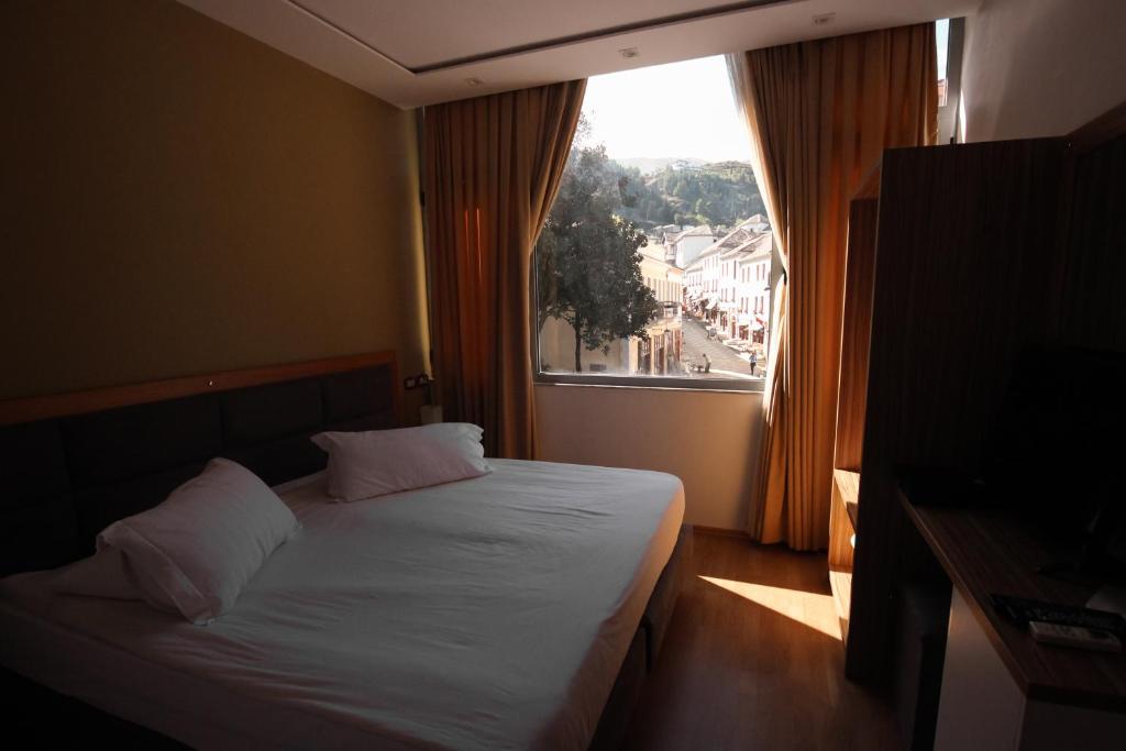 Postel nebo postele na pokoji v ubytování Hotel Cajupi