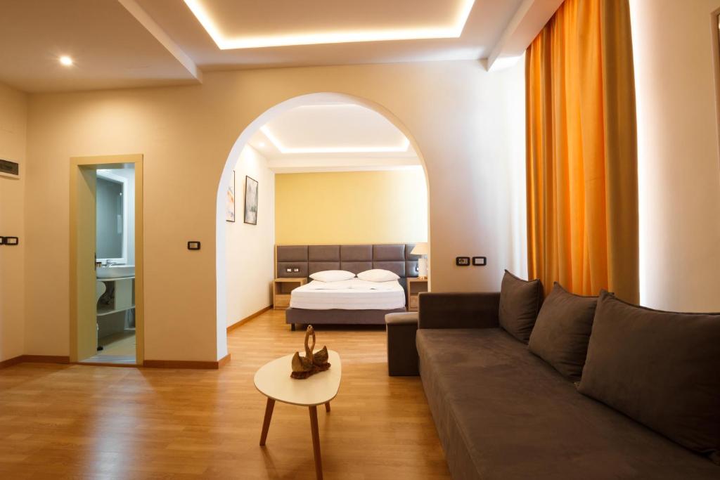 Postel nebo postele na pokoji v ubytování Hotel Cajupi