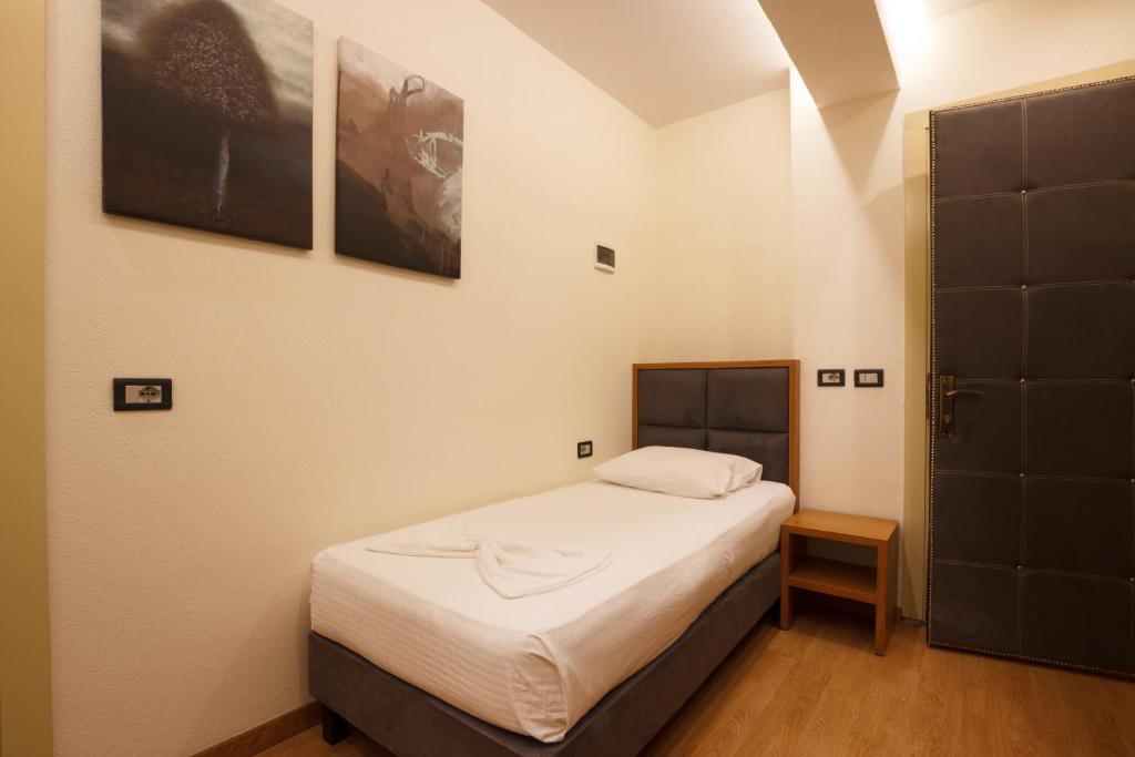 Postel nebo postele na pokoji v ubytování Hotel Cajupi