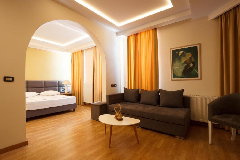 Postel nebo postele na pokoji v ubytování Hotel Cajupi