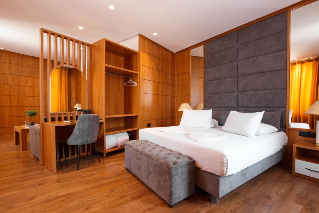 Postel nebo postele na pokoji v ubytování Hotel Cajupi