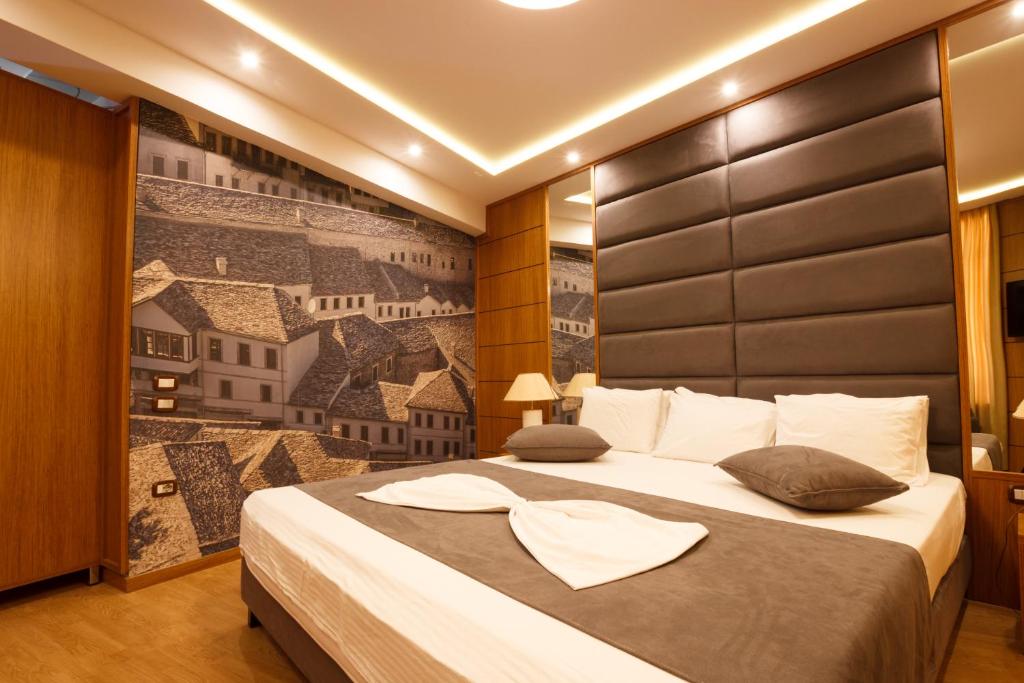 Postel nebo postele na pokoji v ubytování Hotel Cajupi