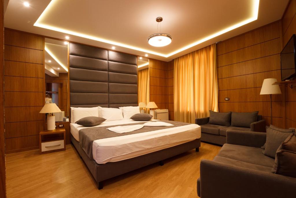 Postel nebo postele na pokoji v ubytování Hotel Cajupi