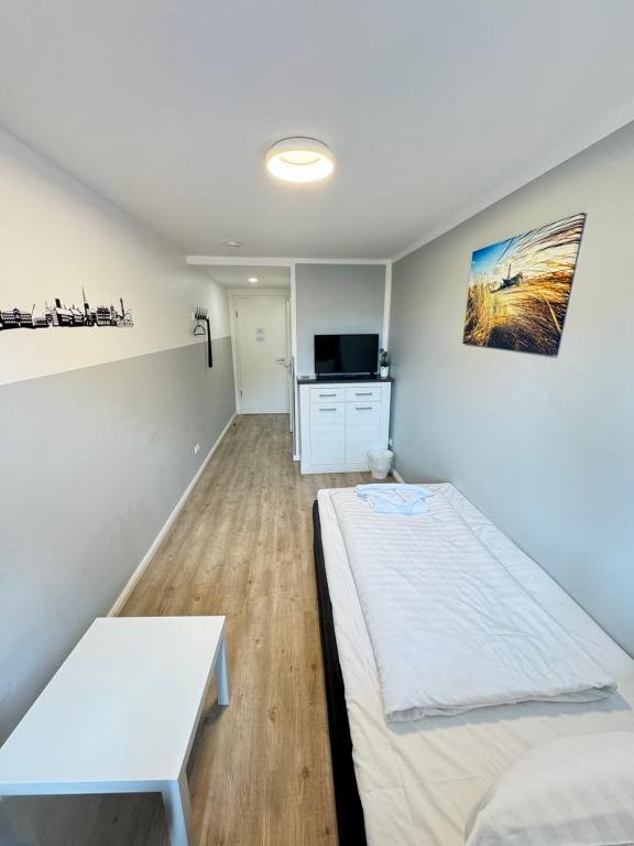Postel nebo postele na pokoji v ubytování Altstadtpension Rostock