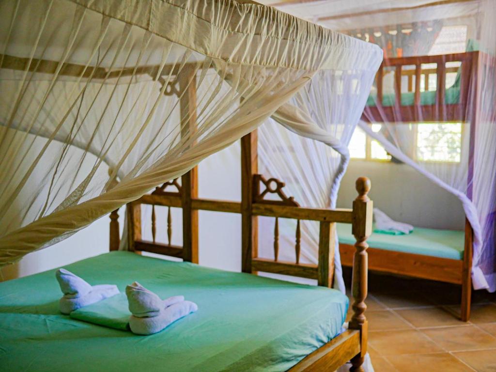 Postel nebo postele na pokoji v ubytování Eden Paradise