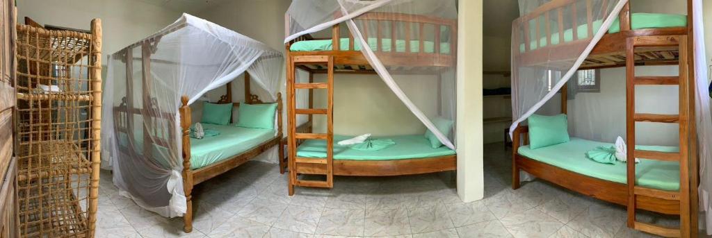 Postel nebo postele na pokoji v ubytování Eden Paradise