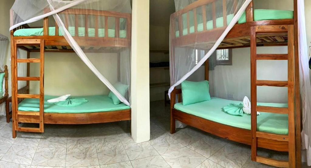 Postel nebo postele na pokoji v ubytování Eden Paradise