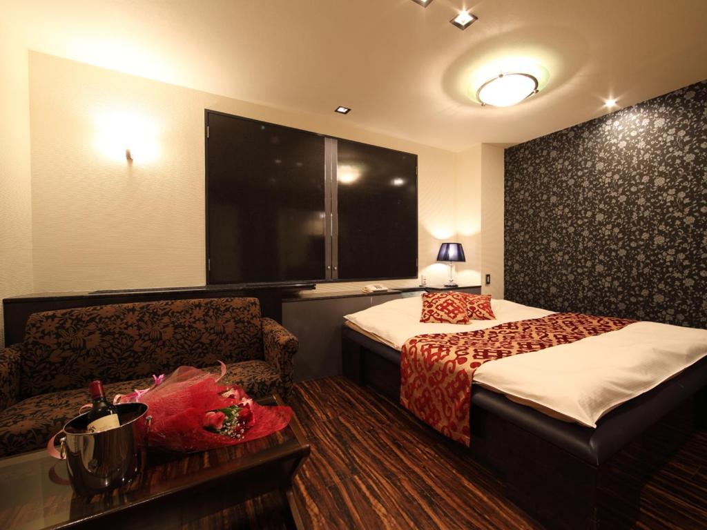 Postel nebo postele na pokoji v ubytování Hotel La Siesta (Adult Only)