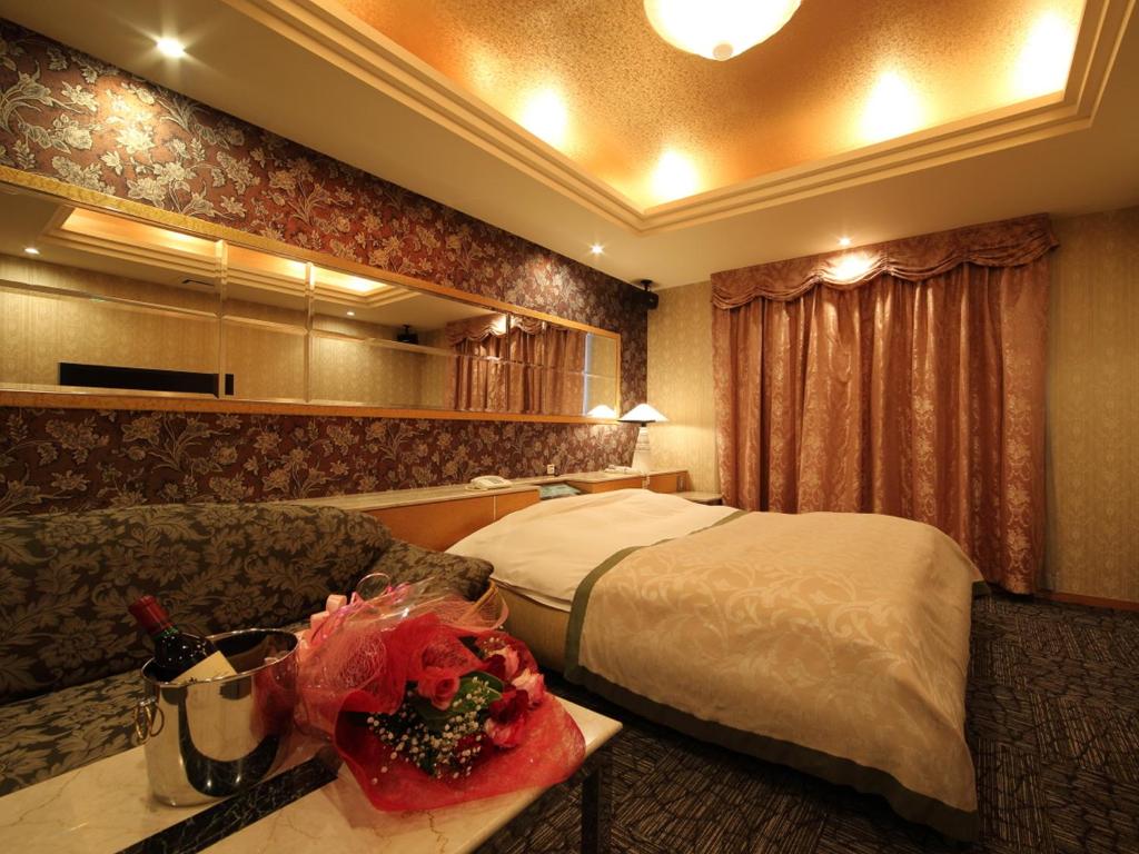 Postel nebo postele na pokoji v ubytování Hotel La Siesta (Adult Only)