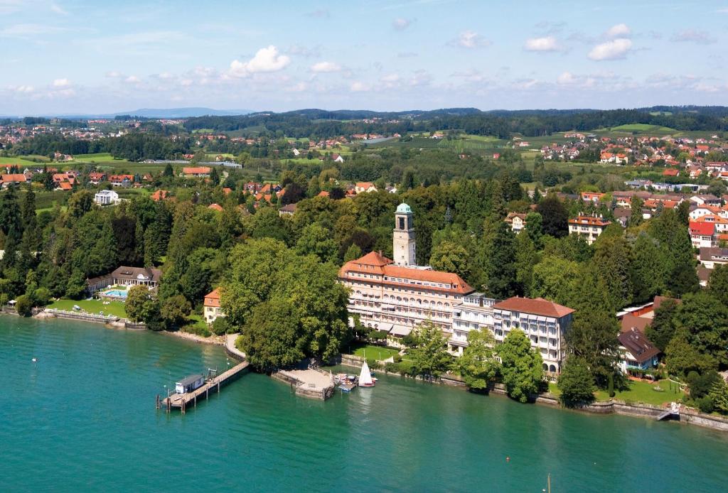 an aerial view of a building on a river at Hotel Bad Schachen in Lindau