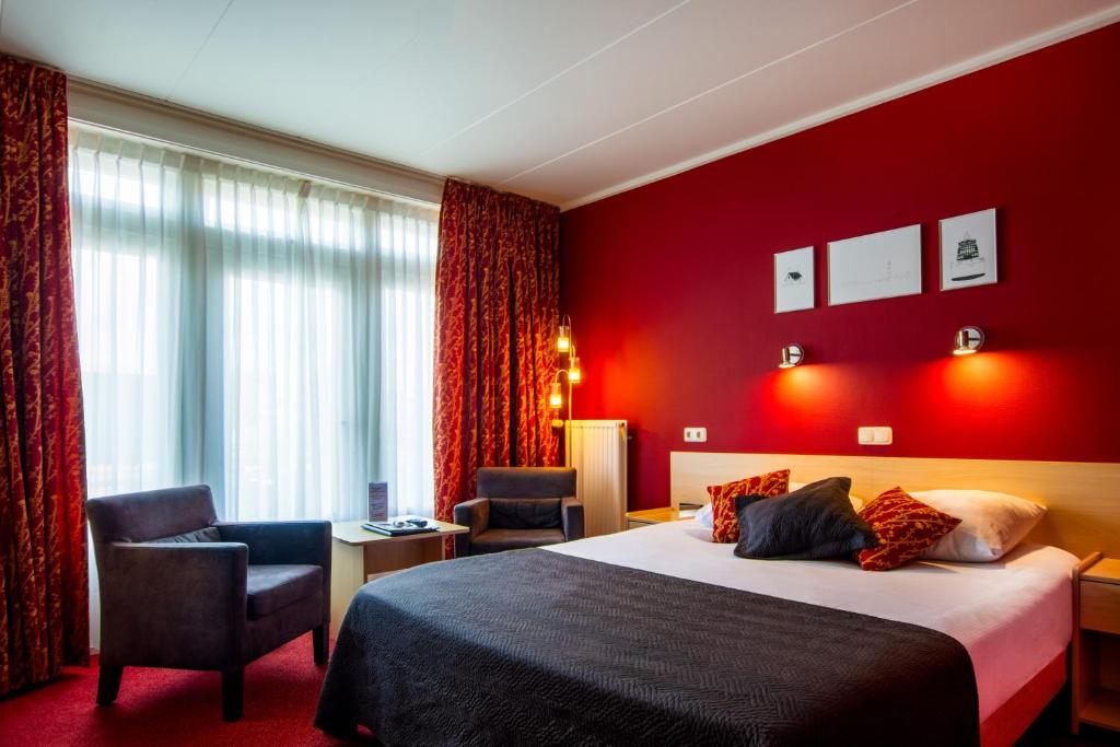 Postel nebo postele na pokoji v ubytování Hotel Oepkes