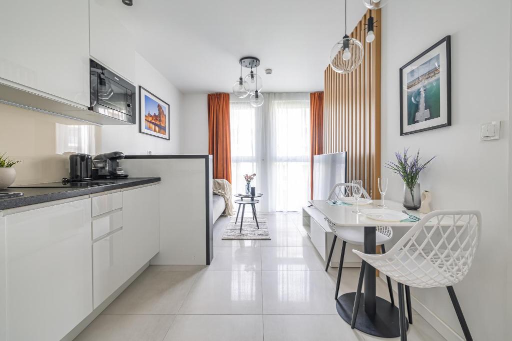 Kuchyňa alebo kuchynka v ubytovaní Apartamenty Central Gdańsk Q4Apartments