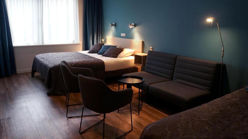 Postel nebo postele na pokoji v ubytování Hotel Oepkes