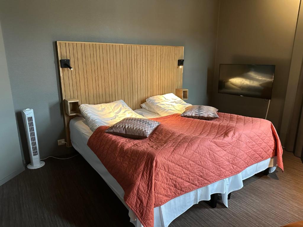 Postel nebo postele na pokoji v ubytování Grong Hotell