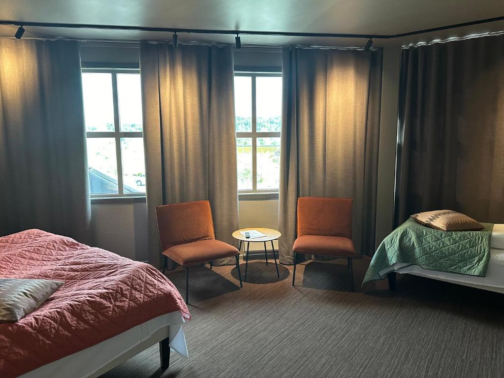 Postel nebo postele na pokoji v ubytování Grong Hotell