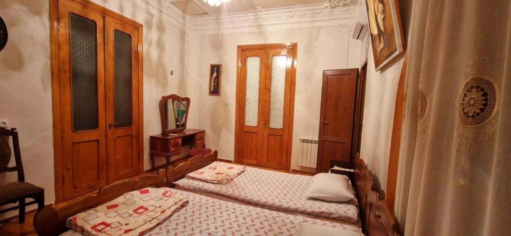 Postel nebo postele na pokoji v ubytování Hotel Kharabadze