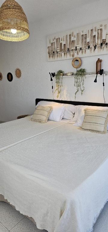 Postel nebo postele na pokoji v ubytování LOS NAREJOS Hotel