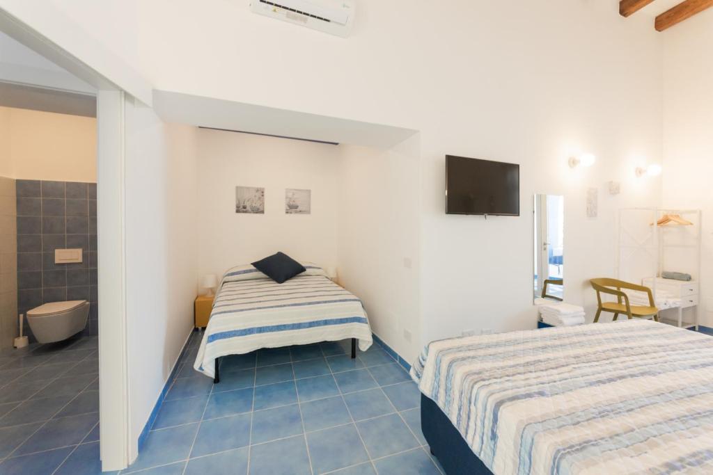 Postel nebo postele na pokoji v ubytování Archi Suite Canneto
