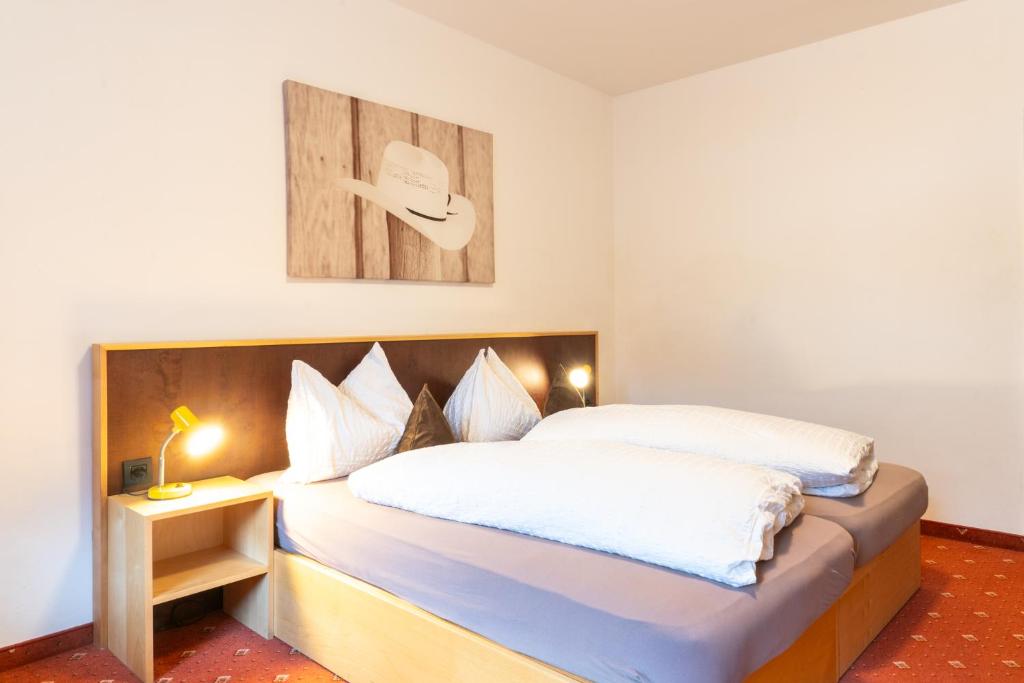 Postel nebo postele na pokoji v ubytování Hotel Martellerhof