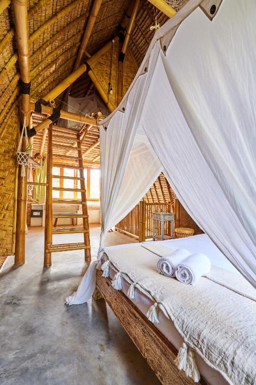 Postel nebo postele na pokoji v ubytování 360 Surf Camp