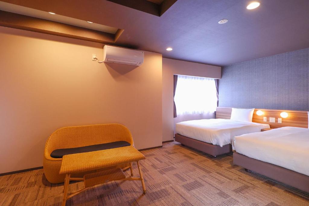 Postel nebo postele na pokoji v ubytování Ooedo Onsen Monogatari Premium Iseshima
