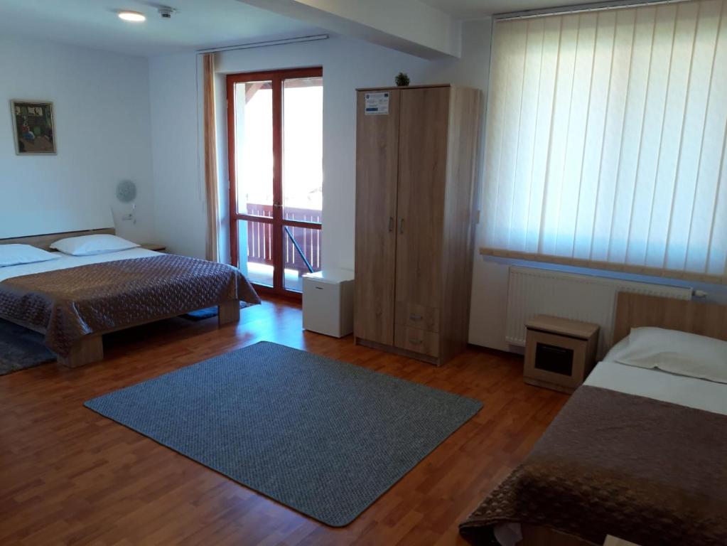 Postel nebo postele na pokoji v ubytování CASA Dana