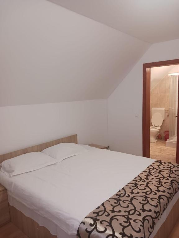 Postel nebo postele na pokoji v ubytování CASA Dana