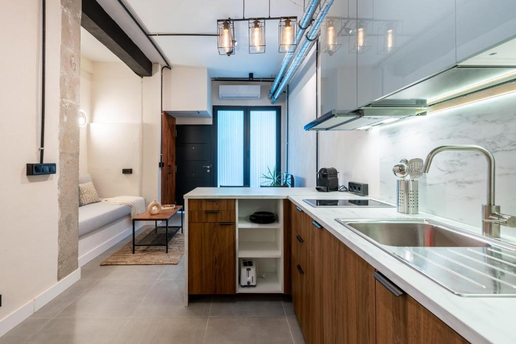 a kitchen with a sink and a counter top at Loft Suite Frutos in Seville