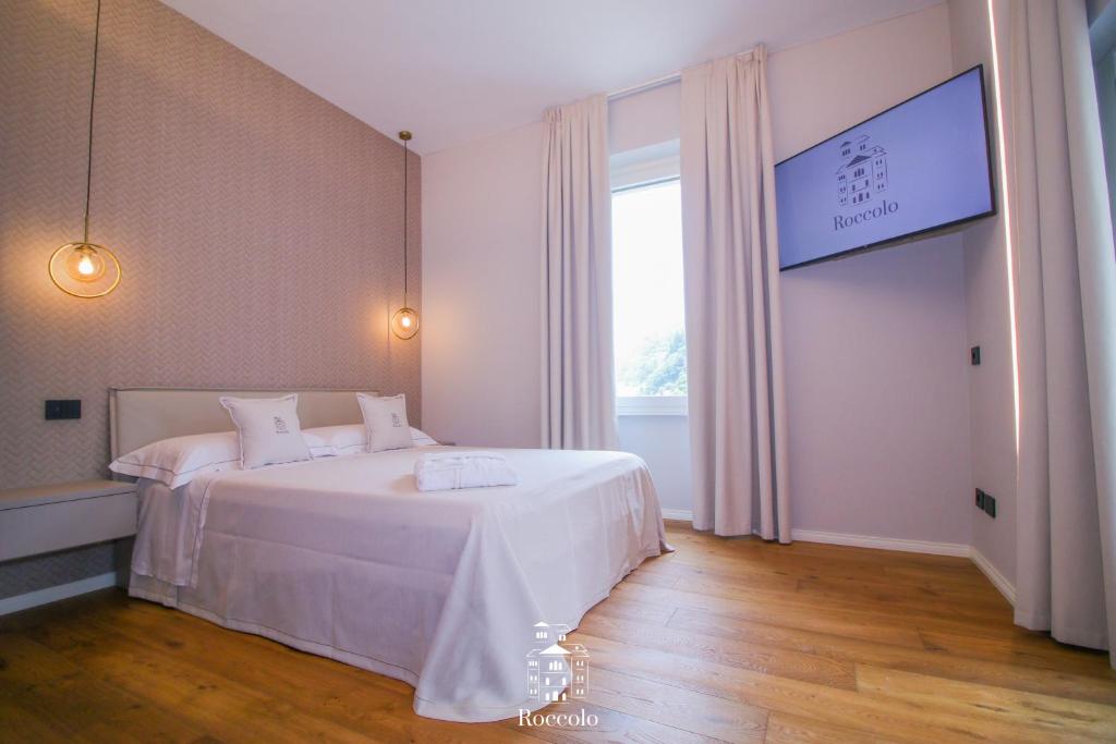 Postel nebo postele na pokoji v ubytování Roccolo Valsesia