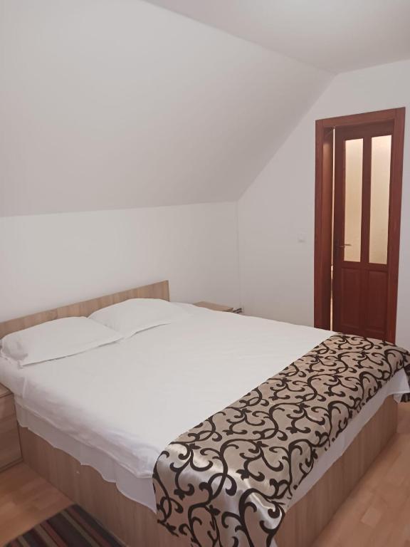 Postel nebo postele na pokoji v ubytování CASA Dana
