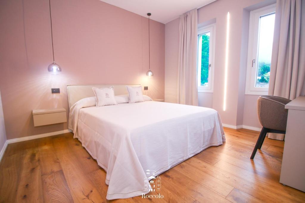 Postel nebo postele na pokoji v ubytování Roccolo Valsesia