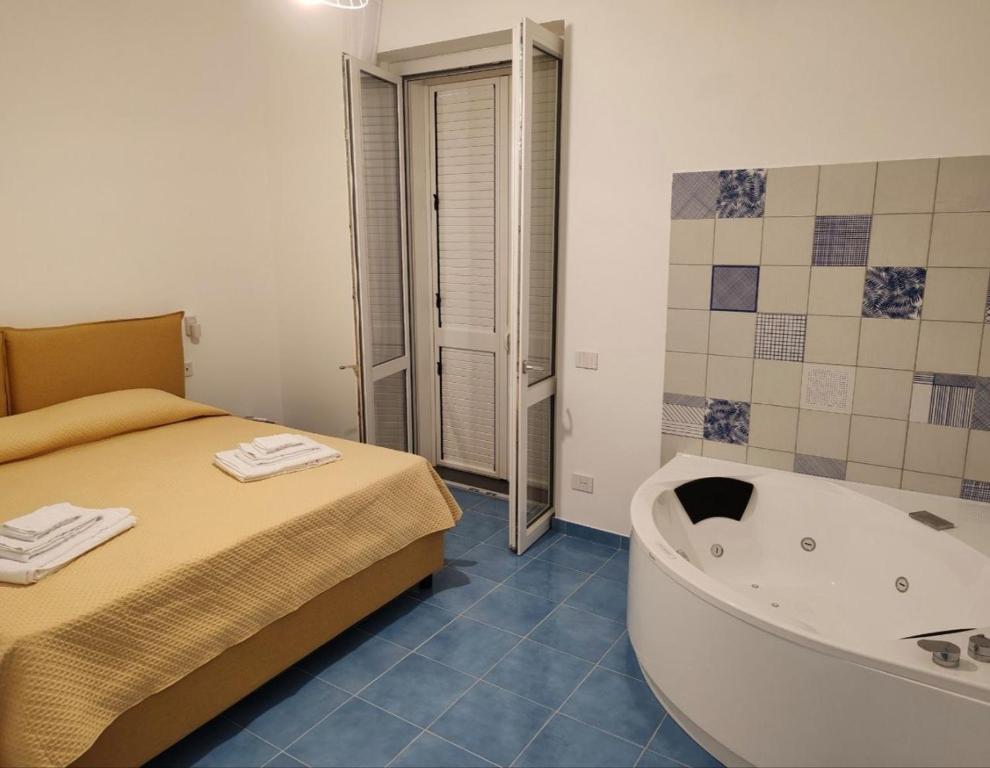 Postel nebo postele na pokoji v ubytování Archi Suite Canneto