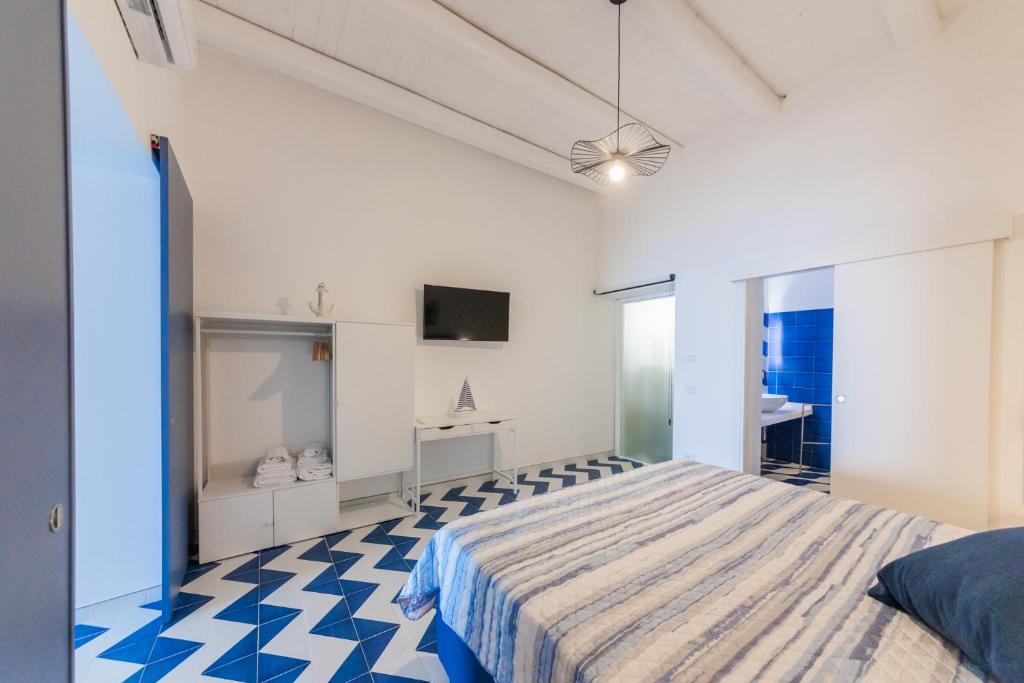 Postel nebo postele na pokoji v ubytování Archi Suite Canneto